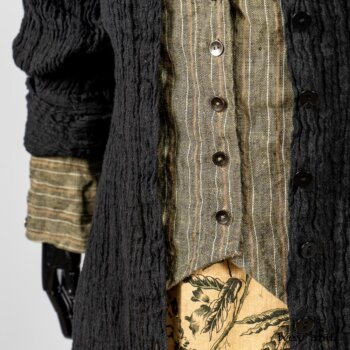 Scattergood Duster Coat in Black Crinkled Washed Linen; Scattergood Frock in Arthurian Green Floral Washed Linen; Truitt Shirt in Peace and Civility Stripe Linen. By Ivey Abitz