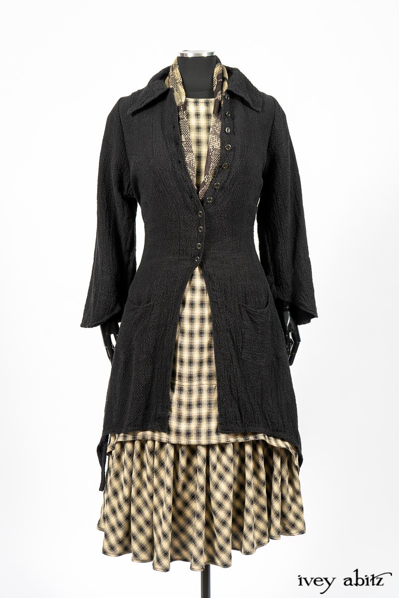 Clotaire Sash in Black and Natural Embroidered Floral Weave; Blanchefleur Frock in Black and Natural Plaid Weave; Elsie Duster Coat in Black Puckered Check Weave. By Ivey Abitz