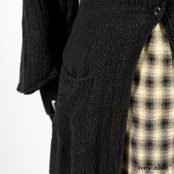 Clotaire Sash in Black and Natural Embroidered Floral Weave; Blanchefleur Frock in Black and Natural Plaid Weave; Elsie Duster Coat in Black Puckered Check Weave. By Ivey Abitz