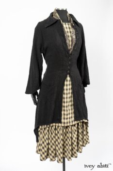 Clotaire Sash in Black and Natural Embroidered Floral Weave; Blanchefleur Frock in Black and Natural Plaid Weave; Elsie Duster Coat in Black Puckered Check Weave. By Ivey Abitz