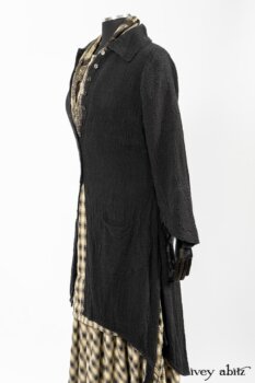 Clotaire Sash in Black and Natural Embroidered Floral Weave; Blanchefleur Frock in Black and Natural Plaid Weave; Elsie Duster Coat in Black Puckered Check Weave. By Ivey Abitz