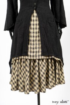 Clotaire Sash in Black and Natural Embroidered Floral Weave; Blanchefleur Frock in Black and Natural Plaid Weave; Elsie Duster Coat in Black Puckered Check Weave. By Ivey Abitz