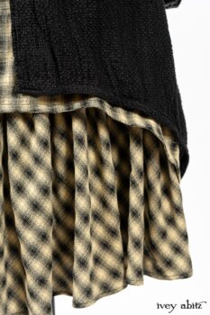Clotaire Sash in Black and Natural Embroidered Floral Weave; Blanchefleur Frock in Black and Natural Plaid Weave; Elsie Duster Coat in Black Puckered Check Weave. By Ivey Abitz