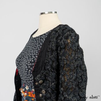 Limited Edition Elliot Jacket in Lakeland Floral Lace Knit; Limited Edition Arthur Hill Frock in Royal Pinstripe Twill; Limited Edition Porte Cochere Sash in Cottage Garden Weave; Fennefleur Frock in Lakeland Flutter Weave. By Ivey Abitz