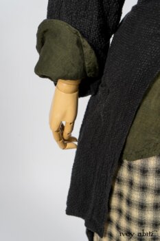 Elsie Duster Coat in Black Puckered Check Weave; Limited Edition Arthur Hill Shirt in Arthurian Green Cotton Voile; Blanchefleur Trousers in Black and Natural Plaid Weave. By Ivey Abitz