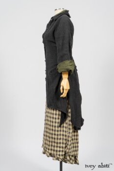 Elsie Duster Coat in Black Puckered Check Weave; Limited Edition Arthur Hill Shirt in Arthurian Green Cotton Voile; Blanchefleur Trousers in Black and Natural Plaid Weave. By Ivey Abitz