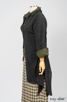 Elsie Duster Coat in Black Puckered Check Weave; Limited Edition Arthur Hill Shirt in Arthurian Green Cotton Voile; Blanchefleur Trousers in Black and Natural Plaid Weave. By Ivey Abitz