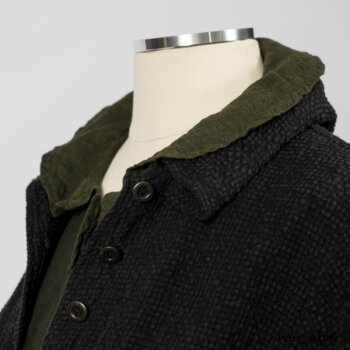 Elsie Duster Coat in Black Puckered Check Weave; Limited Edition Arthur Hill Shirt in Arthurian Green Cotton Voile; Blanchefleur Trousers in Black and Natural Plaid Weave. By Ivey Abitz
