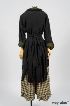 Elsie Duster Coat in Black Puckered Check Weave; Limited Edition Arthur Hill Shirt in Arthurian Green Cotton Voile; Blanchefleur Trousers in Black and Natural Plaid Weave. By Ivey Abitz