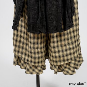 Elsie Duster Coat in Black Puckered Check Weave; Limited Edition Arthur Hill Shirt in Arthurian Green Cotton Voile; Blanchefleur Trousers in Black and Natural Plaid Weave. By Ivey Abitz