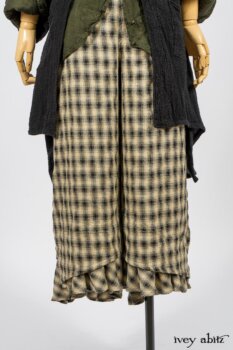 Elsie Duster Coat in Black Puckered Check Weave; Limited Edition Arthur Hill Shirt in Arthurian Green Cotton Voile; Blanchefleur Trousers in Black and Natural Plaid Weave. By Ivey Abitz