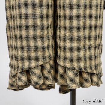 Elsie Duster Coat in Black Puckered Check Weave; Limited Edition Arthur Hill Shirt in Arthurian Green Cotton Voile; Blanchefleur Trousers in Black and Natural Plaid Weave. By Ivey Abitz