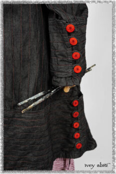 Pierrepont Duster Coat in Beacon Black and Red Pin Tuck Twill; Viv Frock in Red Sky at Night Stripe. Ivey Abitz bespoke clothing.