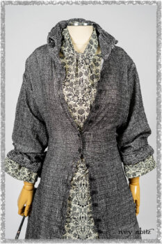 Bartholomew Duster Coat in Black White Painted Puckery Weave; Clotaire Sash in Ethereal Cream and Black Fleur Stretch Cotton; Tollie Dress in Ethereal Cream and Black Fleur Stretch Cotton; Mewland Skirt in Black Washed Crinkled Linen. Ivey Abitz bespoke clothing.