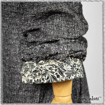 Bartholomew Duster Coat in Black White Painted Puckery Weave; Clotaire Sash in Ethereal Cream and Black Fleur Stretch Cotton; Tollie Dress in Ethereal Cream and Black Fleur Stretch Cotton; Mewland Skirt in Black Washed Crinkled Linen. Ivey Abitz bespoke clothing.