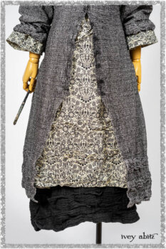 Bartholomew Duster Coat in Black White Painted Puckery Weave; Clotaire Sash in Ethereal Cream and Black Fleur Stretch Cotton; Tollie Dress in Ethereal Cream and Black Fleur Stretch Cotton; Mewland Skirt in Black Washed Crinkled Linen. Ivey Abitz bespoke clothing.
