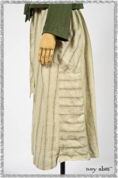 Vanetten Frock in Seagrass Washed Stripe Linen; Chevallier Cardigan in Seagrass Melange Knit; Blanchefleur Sash in Pointillism Silk Chiffon. Ivey Abitz bespoke clothing.