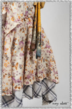 Elliot Jacket in Ethereal Cream Floral Knit; Fairholme Dress in Ethereal Floral Cotton Voile; Fairholme Sash in Ethereal Floral Cotton Voile; Fairholme Frock in Plum Tree Wispy Plaid Cotton. Ivey Abitz bespoke clothing.