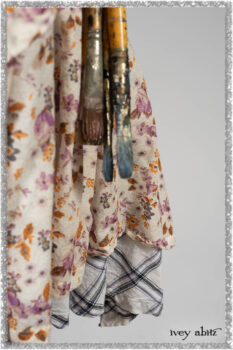 Elliot Jacket in Ethereal Cream Floral Knit; Fairholme Dress in Ethereal Floral Cotton Voile; Fairholme Sash in Ethereal Floral Cotton Voile; Fairholme Frock in Plum Tree Wispy Plaid Cotton. Ivey Abitz bespoke clothing.