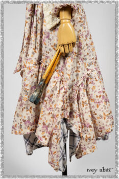 Elliot Jacket in Ethereal Cream Floral Knit; Fairholme Dress in Ethereal Floral Cotton Voile; Fairholme Sash in Ethereal Floral Cotton Voile; Fairholme Frock in Plum Tree Wispy Plaid Cotton. Ivey Abitz bespoke clothing.