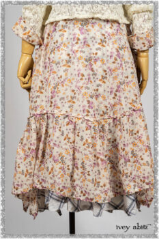 Elliot Jacket in Ethereal Cream Floral Knit; Fairholme Dress in Ethereal Floral Cotton Voile; Fairholme Sash in Ethereal Floral Cotton Voile; Fairholme Frock in Plum Tree Wispy Plaid Cotton. Ivey Abitz bespoke clothing.