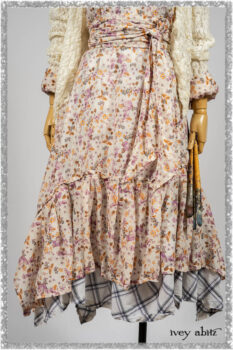 Elliot Jacket in Ethereal Cream Floral Knit; Fairholme Dress in Ethereal Floral Cotton Voile; Fairholme Sash in Ethereal Floral Cotton Voile; Fairholme Frock in Plum Tree Wispy Plaid Cotton. Ivey Abitz bespoke clothing.