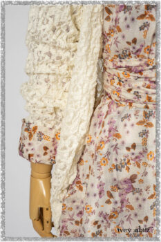 Elliot Jacket in Ethereal Cream Floral Knit; Fairholme Dress in Ethereal Floral Cotton Voile; Fairholme Sash in Ethereal Floral Cotton Voile; Fairholme Frock in Plum Tree Wispy Plaid Cotton. Ivey Abitz bespoke clothing.