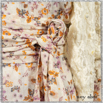 Elliot Jacket in Ethereal Cream Floral Knit; Fairholme Dress in Ethereal Floral Cotton Voile; Fairholme Sash in Ethereal Floral Cotton Voile; Fairholme Frock in Plum Tree Wispy Plaid Cotton. Ivey Abitz bespoke clothing.
