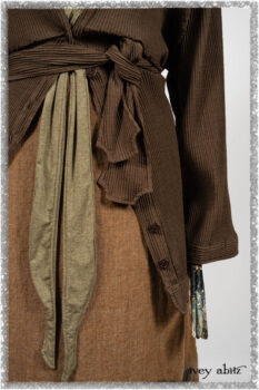 Porte Cochere Jacket in Earthen Ribbed Weave; Saint Ans Frock in Chestnut Tree Wondrous Washed Linen with handsculpted details in rare weaves; Saint Ans Sash in Woodlawn Melange Knit. Ivey Abitz bespoke clothing.