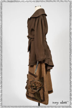 Porte Cochere Jacket in Earthen Ribbed Weave; Saint Ans Frock in Chestnut Tree Wondrous Washed Linen with handsculpted details in rare weaves; Saint Ans Sash in Woodlawn Melange Knit. Ivey Abitz bespoke clothing.