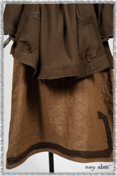 Porte Cochere Jacket in Earthen Ribbed Weave; Saint Ans Frock in Chestnut Tree Wondrous Washed Linen with handsculpted details in rare weaves; Saint Ans Sash in Woodlawn Melange Knit. Ivey Abitz bespoke clothing.