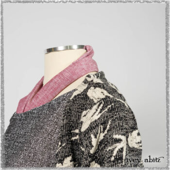Elliot Jacket in Beacon Flora and Fauna Knit; Bramley Overlay in Black White Painted Puckery Weave; Clotaire Sash in Red Sky at Night Yarn Dyed Weave; Mewland Skirt in Black Washed Crinkled Linen. Ivey Abitz bespoke clothing.