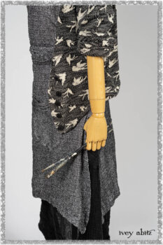 Elliot Jacket in Beacon Flora and Fauna Knit; Bramley Overlay in Black White Painted Puckery Weave; Clotaire Sash in Red Sky at Night Yarn Dyed Weave; Mewland Skirt in Black Washed Crinkled Linen. Ivey Abitz bespoke clothing.