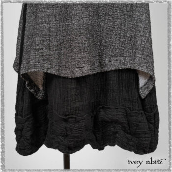 Elliot Jacket in Beacon Flora and Fauna Knit; Bramley Overlay in Black White Painted Puckery Weave; Clotaire Sash in Red Sky at Night Yarn Dyed Weave; Mewland Skirt in Black Washed Crinkled Linen. Ivey Abitz bespoke clothing.