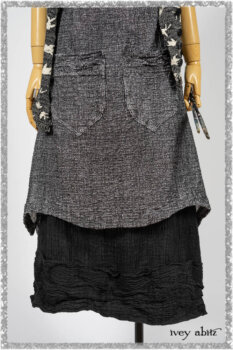 Elliot Jacket in Beacon Flora and Fauna Knit; Bramley Overlay in Black White Painted Puckery Weave; Clotaire Sash in Red Sky at Night Yarn Dyed Weave; Mewland Skirt in Black Washed Crinkled Linen. Ivey Abitz bespoke clothing.