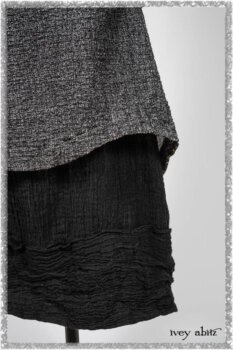 Elliot Jacket in Beacon Flora and Fauna Knit; Bramley Overlay in Black White Painted Puckery Weave; Clotaire Sash in Red Sky at Night Yarn Dyed Weave; Mewland Skirt in Black Washed Crinkled Linen. Ivey Abitz bespoke clothing.