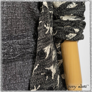 Elliot Jacket in Beacon Flora and Fauna Knit; Bramley Overlay in Black White Painted Puckery Weave; Clotaire Sash in Red Sky at Night Yarn Dyed Weave; Mewland Skirt in Black Washed Crinkled Linen. Ivey Abitz bespoke clothing.