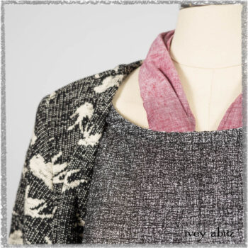 Elliot Jacket in Beacon Flora and Fauna Knit; Bramley Overlay in Black White Painted Puckery Weave; Clotaire Sash in Red Sky at Night Yarn Dyed Weave; Mewland Skirt in Black Washed Crinkled Linen. Ivey Abitz bespoke clothing.