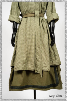 Vanetten Duster Coat in Seagrass Petite Check Linen; Saint Ans Sash in Woodlawn Melange Knit; Saint Ans Frock in Seagrass Crushed Cotton with mix of sculptural details created in rare weaves. Ivey Abitz bespoke clothing.