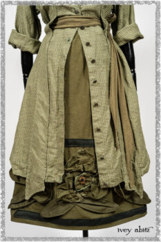 Vanetten Duster Coat in Seagrass Petite Check Linen; Saint Ans Sash in Woodlawn Melange Knit; Saint Ans Frock in Seagrass Crushed Cotton with mix of sculptural details created in rare weaves. Ivey Abitz bespoke clothing.