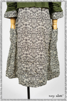 Tollie Dress in Ethereal Cream and Black Fleur Stretch Cotton; Chevallier Cardigan in Seagrass Melange Knit. Ivey Abitz bespoke clothing.