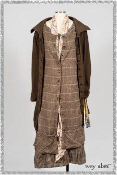 Porte Cochere Shirt Jacket in Earthen Ribbed Weave; Fairholme Sash in Ethereal Floral Cotton Voile; Porte Cochere Frock in Earthen and Plum Stretch Plaid; Gabled Frock in Plum Tree and Woodlawn Check Cotton. Ivey Abitz bespoke clothing.