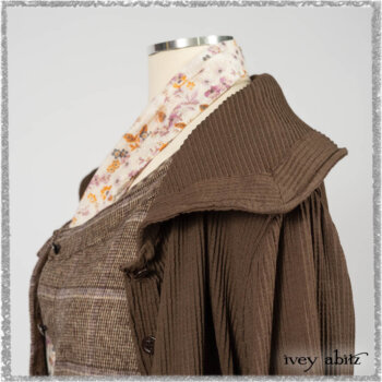Porte Cochere Shirt Jacket in Earthen Ribbed Weave; Fairholme Sash in Ethereal Floral Cotton Voile; Porte Cochere Frock in Earthen and Plum Stretch Plaid; Gabled Frock in Plum Tree and Woodlawn Check Cotton. Ivey Abitz bespoke clothing.