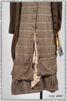 Porte Cochere Shirt Jacket in Earthen Ribbed Weave; Fairholme Sash in Ethereal Floral Cotton Voile; Porte Cochere Frock in Earthen and Plum Stretch Plaid; Gabled Frock in Plum Tree and Woodlawn Check Cotton. Ivey Abitz bespoke clothing.