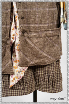 Porte Cochere Shirt Jacket in Earthen Ribbed Weave; Fairholme Sash in Ethereal Floral Cotton Voile; Porte Cochere Frock in Earthen and Plum Stretch Plaid; Gabled Frock in Plum Tree and Woodlawn Check Cotton. Ivey Abitz bespoke clothing.