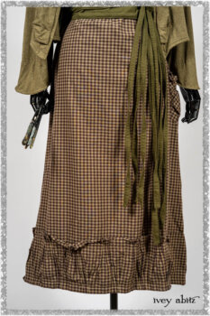 Saint Ans Jacket in Woodlawn Melange Knit; Porte Cochere Sash in Seagrass Crushed Cotton; Gabled Frock in Plum Tree and Woodlawn Check Cotton. Ivey Abitz bespoke clothing.