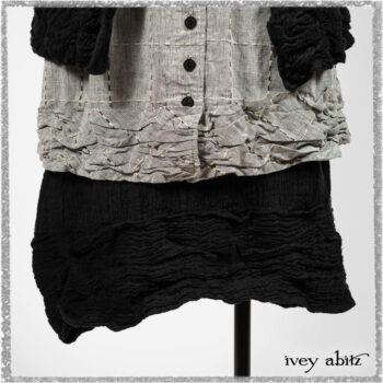 Mewland Jacket in Black Washed Crinkled Linen; Clotaire Sash in Ethereal Cream and Black Fleur Stretch Cotton; Mewland Vest in Beacon Black Embroidered Plaid on Petite Stripe; Mewland Skirt in Black Washed Crinkled Linen. Ivey Abitz bespoke clothing.
