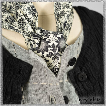 Mewland Jacket in Black Washed Crinkled Linen; Clotaire Sash in Ethereal Cream and Black Fleur Stretch Cotton; Mewland Vest in Beacon Black Embroidered Plaid on Petite Stripe; Mewland Skirt in Black Washed Crinkled Linen. Ivey Abitz bespoke clothing.