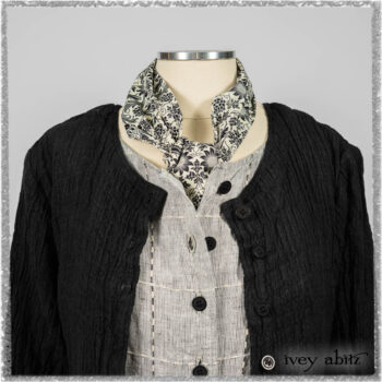 Mewland Jacket in Black Washed Crinkled Linen; Clotaire Sash in Ethereal Cream and Black Fleur Stretch Cotton; Mewland Vest in Beacon Black Embroidered Plaid on Petite Stripe; Mewland Skirt in Black Washed Crinkled Linen. Ivey Abitz bespoke clothing.