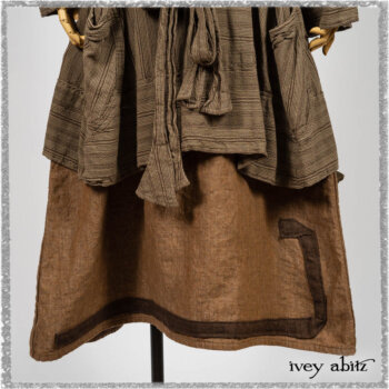 Saint Ans Frock in Chestnut Tree Wondrous Washed Linen with sculptural details in rare weaves; Hudson Duster Coat in Earthen Embroidered Stripe Gauze. Ivey Abitz bespoke clothing.